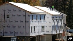 FILE - Construction on new homes is underway in Canonsburg, Pennsylvania, Nov. 10, 2016.