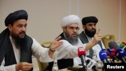 Members of Taliban political office attend a news conference in Moscow