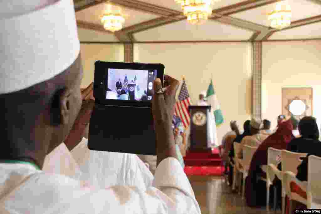 An audience member takes a picture of U.S. Secretary of State John Kerry and Sultan of Sokoto Sa'adu Abubakar at the sultan's palace in Sokoto, Nigeria, Aug. 23, 2016.