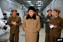 FILE - This undated photo released by North Korea's official Korean Central News Agency (KCNA) on April 2, 2016 shows North Korean leader Kim Jong-Un (C) at the Tonghungsan Machine Plant.