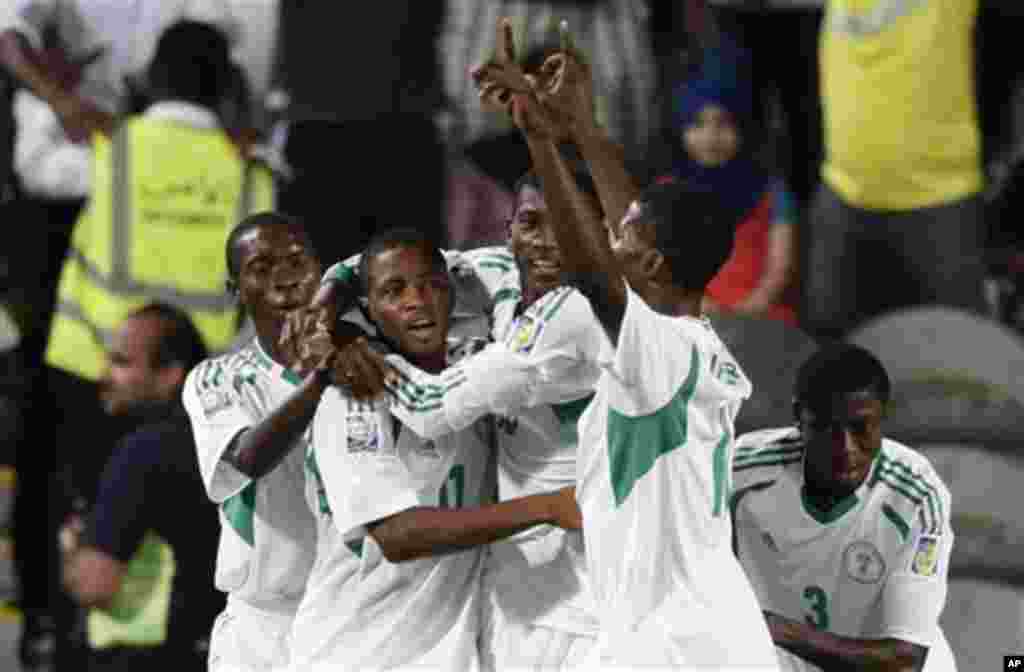 Nigeria's Musa Yahaya, second left, celebrates after an own goal by Mexican player Erick Aguirre during the World Cup U-17 final soccer match between Nigeria and Mexico at Mohammad Bin Zayed stadium in Abu Dhabi, United Arab Emirates, Friday, Nov. 8, 2013
