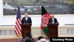 Afghan President Ashraf Ghani (right), and U.S. Secretary of State Mike Pompeo speak at a joint press conference at the Presidential Palace, in Kabul, Afghanistan, July 9, 2018. (Courtesy - Presidential Palace)