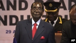 FILE - Zimbabwean President Robert Mugabe attends last years's Southern African Development Community (SADC) Heads of State and Government Extraordinary Summit in Harare, Apr. 29, 2015.