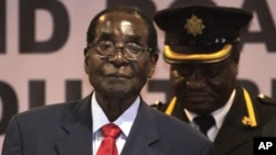 FILE - Zimbabwean President Robert Mugabe attends lasy years's Southern African Development Community (SADC) Heads of State and Government Extraordinary Summit in Harare, Apr. 29, 2015.