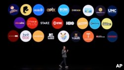 Peter Stern, Apple Vice President of Services, speaks at the Steve Jobs Theater during an event to announce new products, March 25, 2019, in Cupertino, California. 