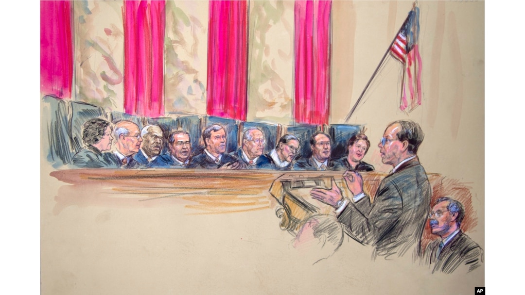 This artist rendering shows Paul Clement, second from left, with Solicitor General Donald B. Verrilli Jr. seated, right, addresses the Supreme Court in Washington, Wednesday, March 27, 2013, as the court heard arguments on the Defense of Marriage Act (DOMA) case.