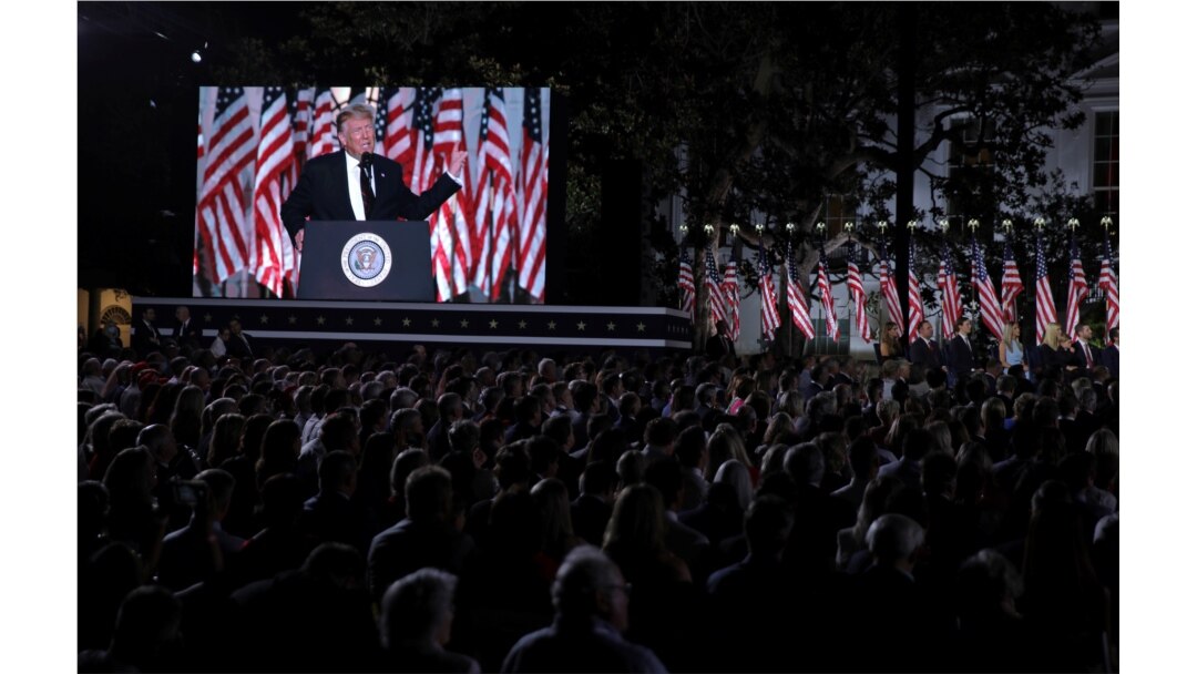 U.S. President Donald Trump is seen on a screen as he delivers his acceptance speech as the 2020 Republican presidential nominee during the final event of the Republican National Convention on the South Lawn of the White House in Washington.