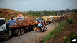 FILE - A convoy of over 100 trucks arriving in the Central African Republic capital, Bangui, from Cameroon.