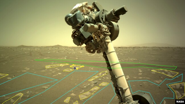 The robotic arm of NASA’s Perseverance rover is visible in this image used by the AI4Mars project. Users outline and identify different rock and landscape features to help train an artificial intelligence algorithm that will help improve the capabilities