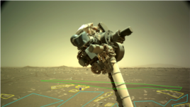 The robotic arm of NASA’s Perseverance rover is visible in this image used by the AI4Mars project. Users outline and identify different rock and landscape features to help train an artificial intelligence algorithm that will help improve the capabilities