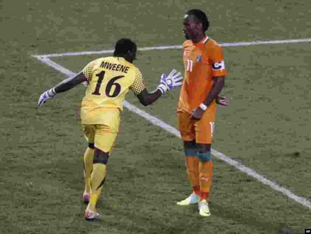 Zambia's goalkeeper Kennedy Mweene (L) reacts after Ivory Coast's Dider Drogba missed his penalty during their African Nations Cup final soccer match at the Stade De L'Amitie Stadium in Libreville February 12, 2012.