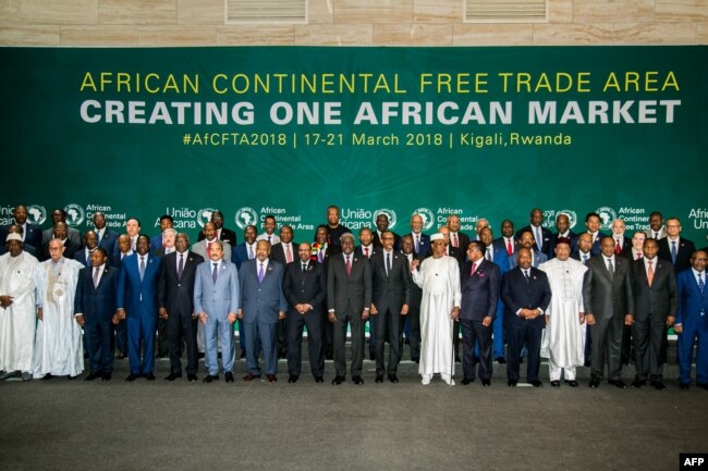 FILE - The African Heads of States and Governments pose during the African Union Summit for the agreement to establish the African Continental Free Trade Area in Kigali, Rwanda, March 21, 2018.