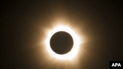 FILE - The moment of a total solar eclipse is observed at Cape Tribulation in Queensland state, Australia, November 14, 2012