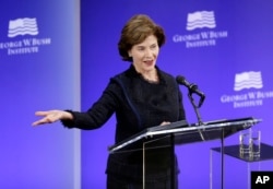 Former first lady Laura Bush speaks at a forum sponsored by the George W. Bush Institute in New York, Oct. 19, 2017.