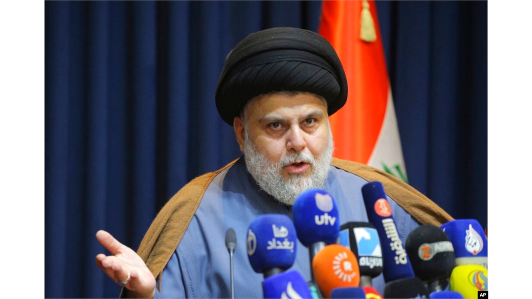 FILE - Populist Shiite cleric Moqtada al-Sadr speaks during a press conference in Najaf, Iraq, Nov. 18, 2021.