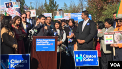 A small rally of local south Asian Democrats protesting outside the convention center calls for unity among minorities. (E. Sarai/VOA)