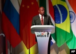 South African President Cyril Ramaphosa speaks during his opening of the BRICS Summit in JOhannesburg, July 25 2018. The summit runs through Friday with various heads of BRICS attending.