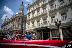 A vintage American car is parked in front of the Inglaterra hotel in Havana, Cuba, June 17, 2017.