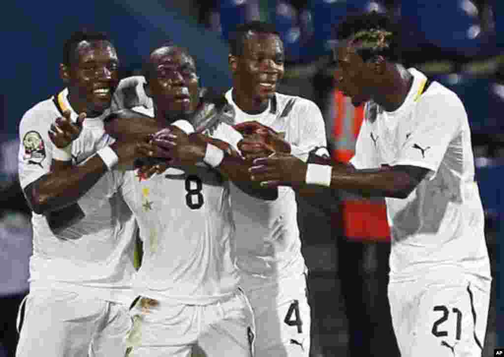 Ghana's Badu Emmanuel Agyemang (8) celebrates his goal with teammates during their African Cup of Nations Group D soccer match against Guinea at Franceville stadium February 1, 2012.