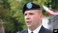 FILE - Lt. Gen. Ben Hodges, the U.S. Army commander in Europe, speaks to the press after the Polish Army Day military parade in Warsaw, Poland, Aug. 15, 2016.