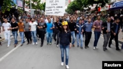 Protesters march as they demonstrate to blame the ruling AK Party (AKP) government for the mining disaster in Soma, a district in Turkey's western province of Manisa May 16, 2014. Turkish police fired water cannon and tear gas on Friday to disperse a crow