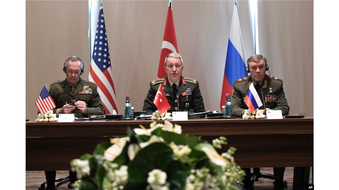 Turkey's Chief of Staff Gen. Hulusi Akar, center, U.S. Chairman of the Joint Chiefs of Staff Gen. Joseph Dunford, left, and Russia's Chief of Staff Gen. Valery Gerasimov attend a meeting in the Mediterranean coastal city of Antalya, Turkey, March 7, 2017.