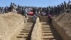 Graves are prepared for the burial of civilians killed by insurgents at Mirza Olang village, in Sar-e Pul province, Afghanistan, Aug. 16, 2017.