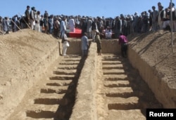 Graves are prepared for the burial of civilians killed by insurgents at Mirza Olang village, in Sar-e Pul province, Afghanistan, Aug. 16, 2017.