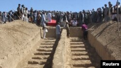 Graves are prepared for the burial of civilians killed by insurgents at Mirza Olang village, in Sar-e Pul province, Afghanistan, Aug. 16, 2017.