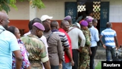 Military personnel vote at a polling station in Brazzaville, Congo, October 25, 2015. 