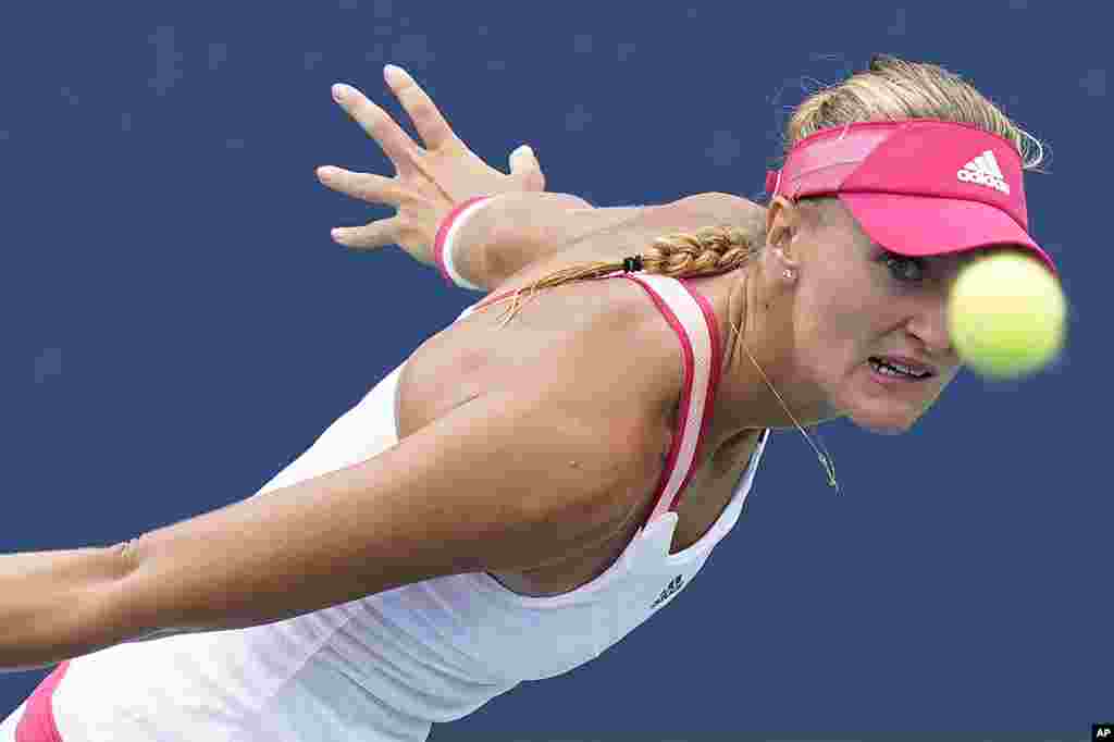 Kristina Mladenovic of France returns a shot to Varvara Gracheva of Russia during the second round of the U.S. Open tennis championships in New York.