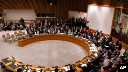 Member states vote to approve a resolution that will impose a no-fly zone over Libya during a meeting of the United Nations Security Council at U.N. headquarters, March 17, 2011