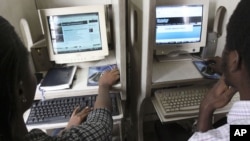 FILE - Nigerians browse the internet at a cybercafe in Lagos, Nigeria. 