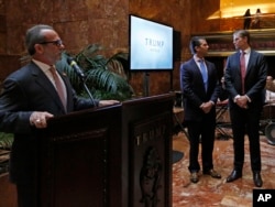 Trump Hotels CEO Eric Danziger, left, speaks as Donald Trump Jr., center, and Eric Trump glance around the room during an event, June 5, 2017, at Trump Tower in New York. The Trump Organization is launching a new mid-market hotel chain called "American Idea."