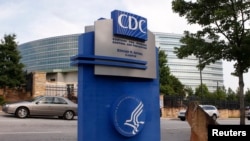FILE - The Centers for Disease Control sign is seen at its main facility in Atlanta, Georgia, June 20, 2014.