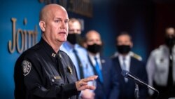 Captain Jay Baker, of the Cherokee County Sheriff's Office, speaks to the news media during a briefing after the fatal shootings