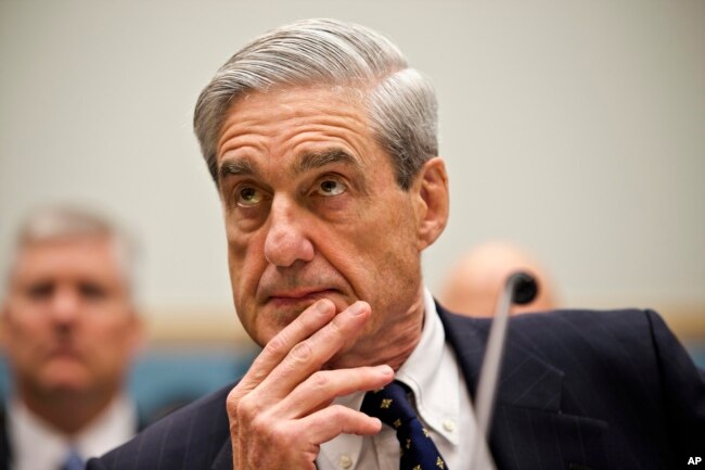 FILE - Then-FBI Director Robert Mueller testifies on Capitol Hill in Washington, June 13, 2013.