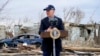 President Joe Biden speaks after surveying storm damage from tornadoes and extreme weather in Dawson Springs, Ky., Dec. 15, 2021.