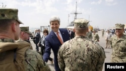 U.S. Secretary of State John Kerry (C) meets U.S. military personnel on a tour of the Naval Support Activity Bahrain base in the Gulf, in Manama, Bahrain, April 7, 2016.