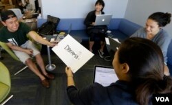 Students create pamphlets for Asian and Pacific Islands students about the Undocumented Student and AB540 Center at the University of California-Davis in 2015. (AP Photo/Rich Pedroncelli)