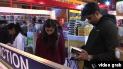 Young people in India at a book store. 
