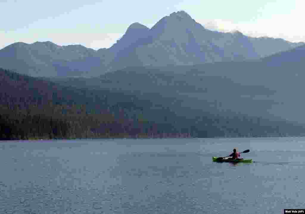 Ingrid Forsmark kayaks on Kintla Lake in Glacier National Park, Montana.