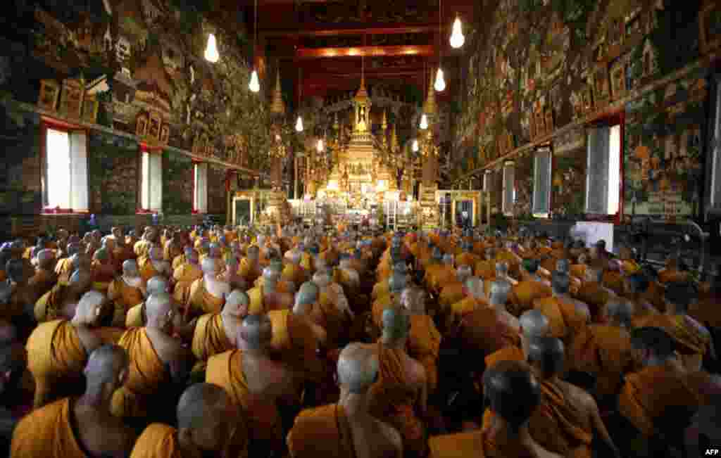 January 21: Buddhist monks pray during a religious ceremony held to mark King Bhumibol Adulyadej's 84th birthday anniversary at the Wat Phra Kaew Temple of the Emerald Buddha in Bangkok. (Reuters/Chaiwat Subprasom)