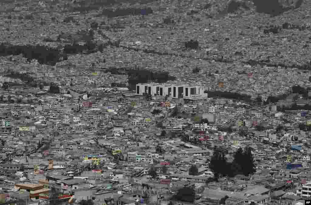 The Social Security hospital, which attends COVID-19 patients, stands tall amid homes on the south side of Quito, Ecuador, Aug. 17, 2020.