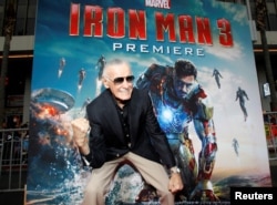 FILE PHOTO: Stan Lee gestures as he poses at the premiere of "Iron Man 3" at El Capitan Theater in Hollywood, California, U.S., April 24, 2013.