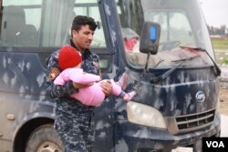 Iraqi forces drive families from the front lines to camps where they are registered and their names are checked against lists of known IS soldiers. But as government and aid groups scramble to build more camps, families are pouring out of the wars zone faster than ever in Mosul, Iraq, March 16, 2017. (H. Murdock/VOA)