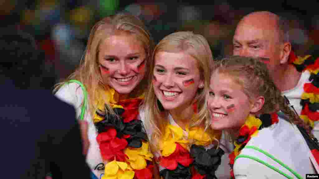 German fans have their photo taken before the opening ceremony. (Reuters/Mike Blake)