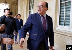 Julio Borges, president of the Venezuelan parliament, arrives for a meeting with Ernesto Macias, president of Colombia's Senate, at the Congress in Bogota, Colombia, Aug. 8, 2018.