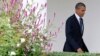 President Obama walks from the Oval Office of the White House before traveling to the UN General Assembly. Sept. 23, 2013.