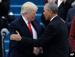 President-elect Donald Trump, left, shakes hands with President Barack Obama before the 58th Presidential Inauguration at the U.S. Capitol in Washington, Jan. 20, 2017.